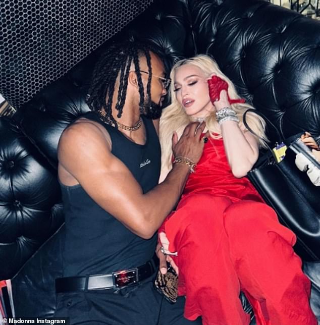 Madonna put on a loving show with a grieving young man on July 4 as she reflected on the one-year anniversary of her near-death health scare.