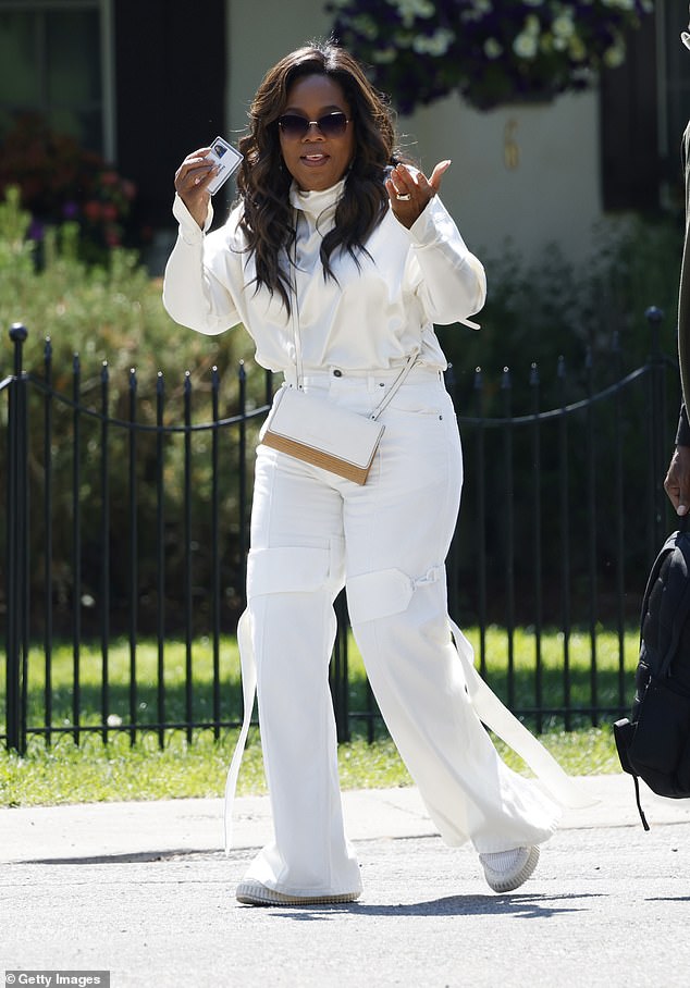 Oprah Winfrey was seen wearing a white sweater, casual jeans, a pair of white sneakers and a crossbody bag with minimal jewelry.